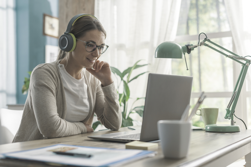 Woman completing a remote online appointment from her laptop